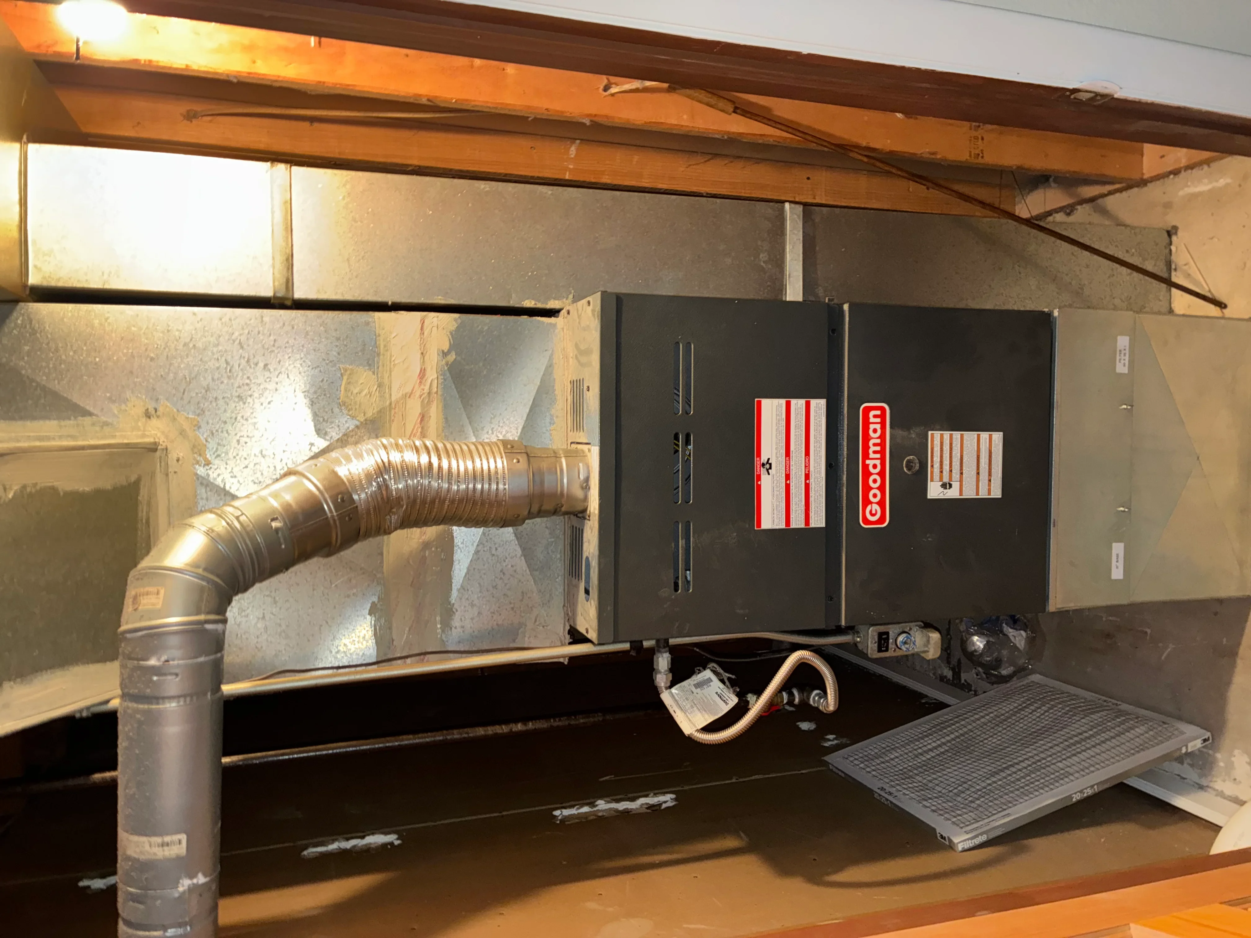 Goodman furnace installation with metal ductwork and filter return in basement
